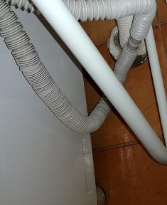 洗濯排水口の詰まり除去